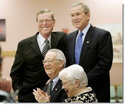 President George W. Bush and Senator Pete Domenici, R-NM., visit with breakfast guests at Bear Canyon Senior Center, Tuesday, March 22, 2005, in Albuquerque. The two visited with more than 30 seniors who were on hand to hear the president’s proposals for Social Security reform. White House photo by Eric Draper 