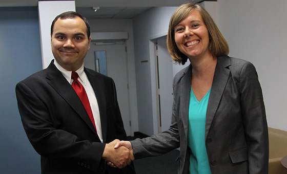 Businessman and Businesswoman shake hands